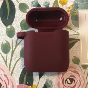 A burgundy are pods case